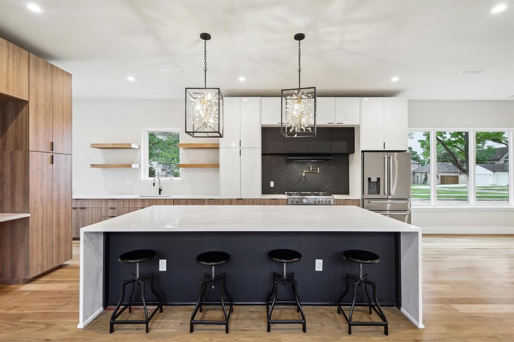 3902 Park Lane Dallas, TX 75220 - Photo 6 of 36 a large kitchen with a table and chairs