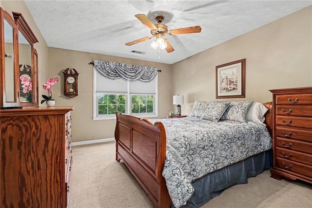 740 Smyrna Road Southwest Conyers, GA 30094 - Photo 17 of 27 a bed room with a bed and a window