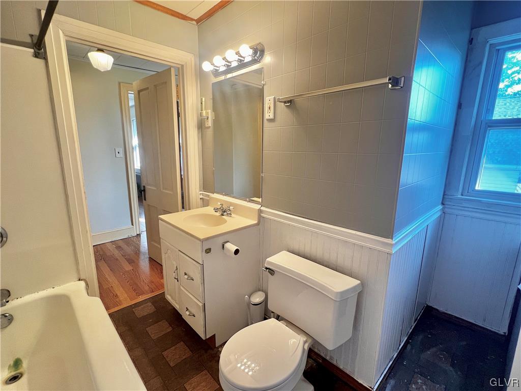 705 Main Street Stockertown, PA 18083 - Photo 16 of 23 a bathroom with a sink a toilet a mirror and shower