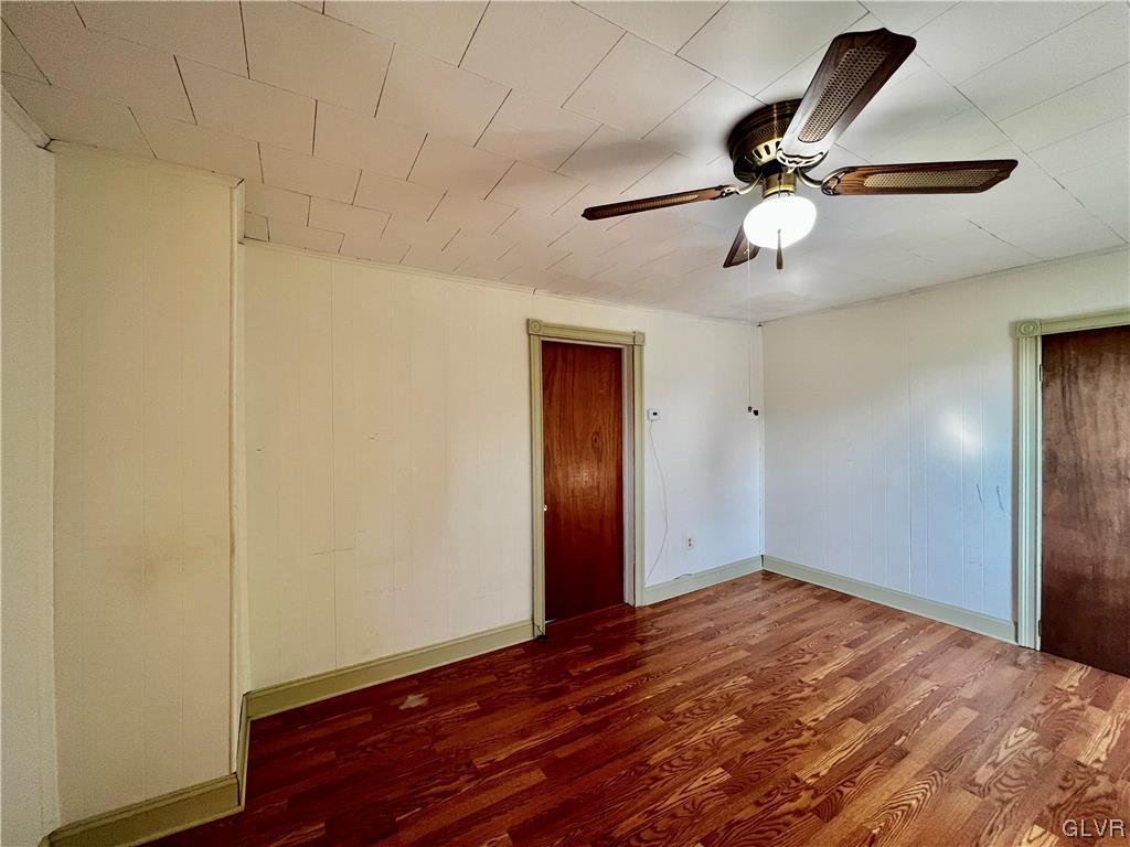 705 Main Street Stockertown, PA 18083 - Photo 18 of 23 a view of room with wooden floor and ceiling fan