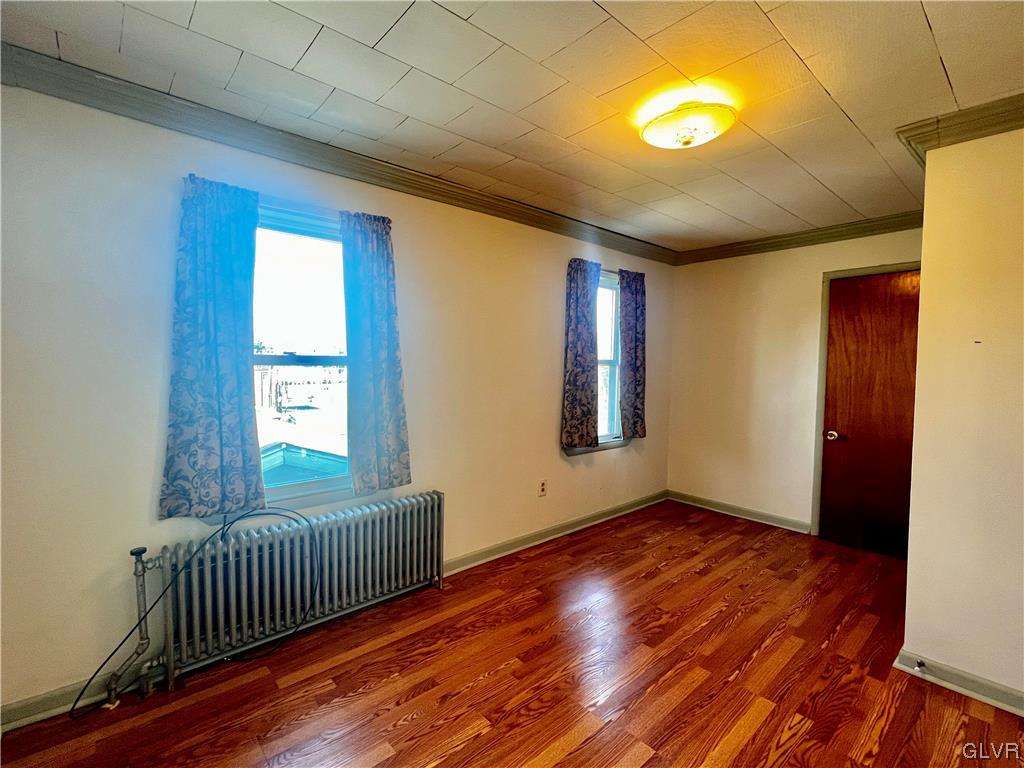 705 Main Street Stockertown, PA 18083 - Photo 19 of 23 a view of an empty room with window and wooden floor