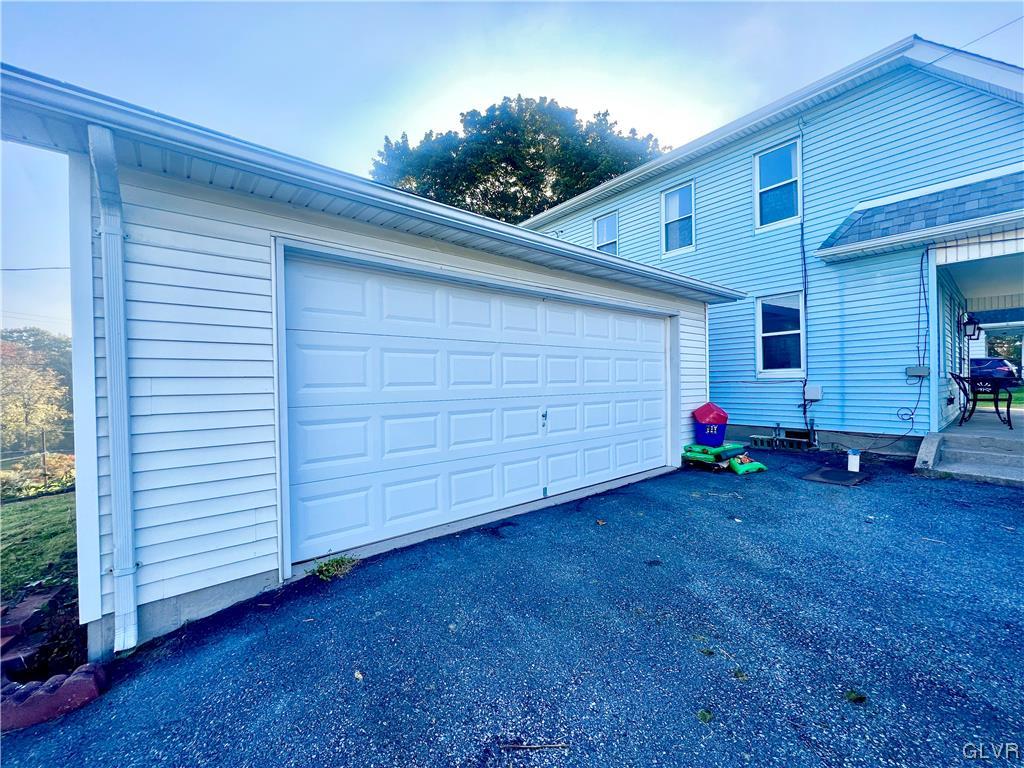 705 Main Street Stockertown, PA 18083 - Photo 22 of 23 a view of a backyard space and garage