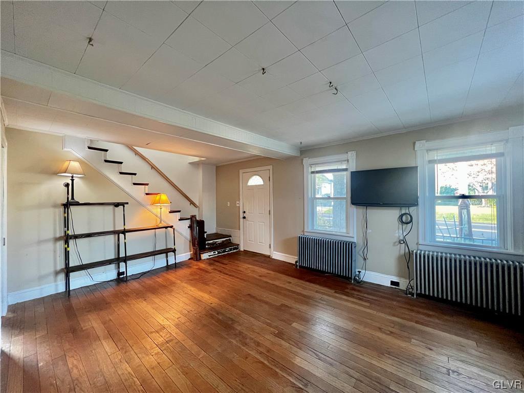 705 Main Street Stockertown, PA 18083 - Photo 4 of 23 wooden floor in an empty room with a window