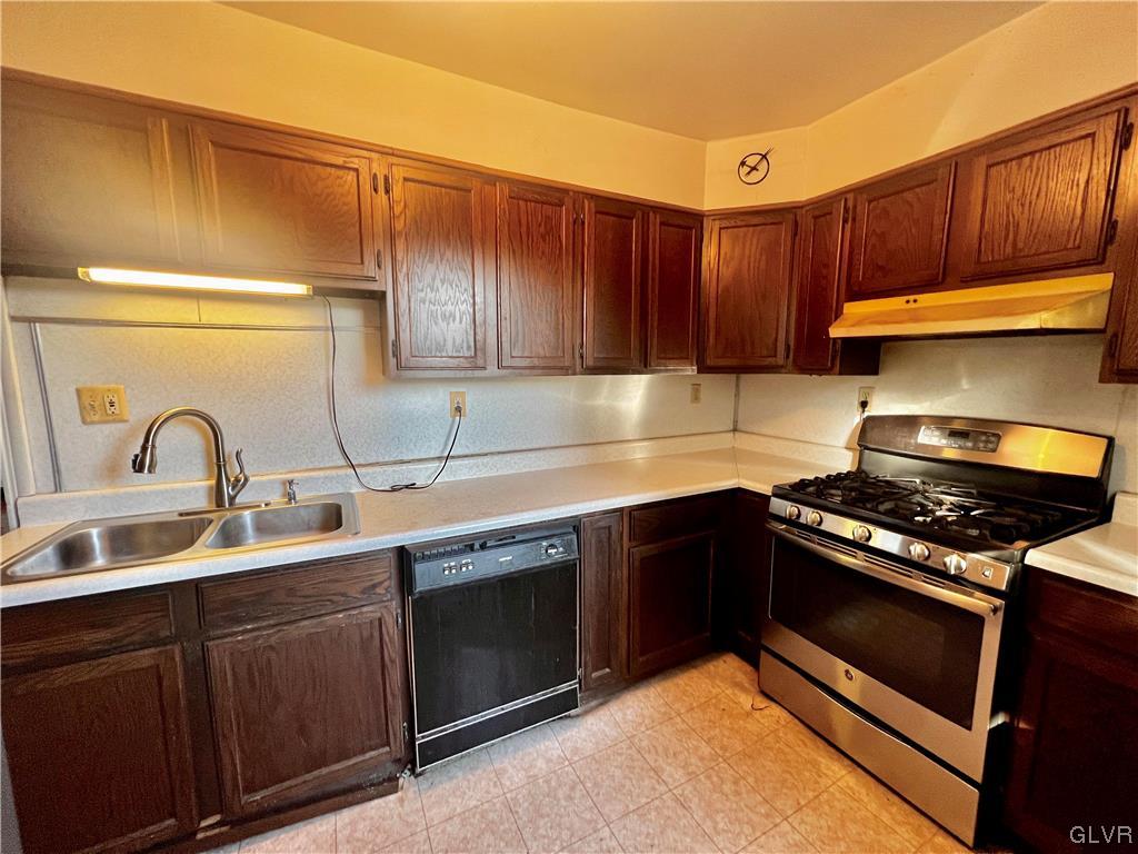 705 Main Street Stockertown, PA 18083 - Photo 7 of 23 a kitchen with sink a stove and cabinets