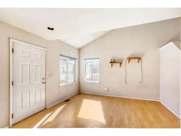 a view of an empty room with a window