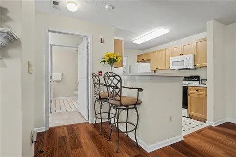 a view of a kitchen and dining room