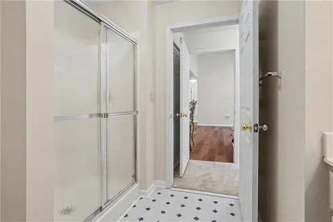 a bathroom with a shower and a sink