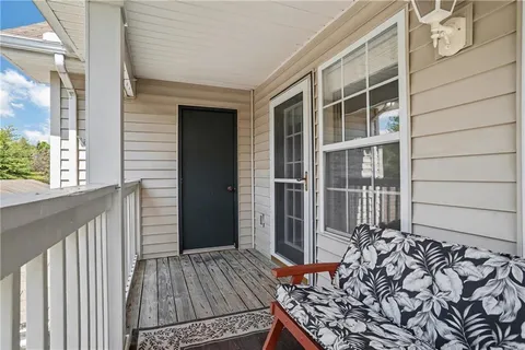 a view of a house with a door and wooden floor