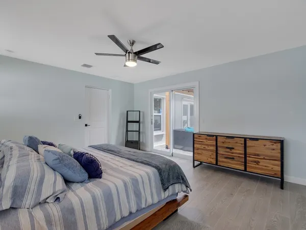 a bed room with a bed and a window