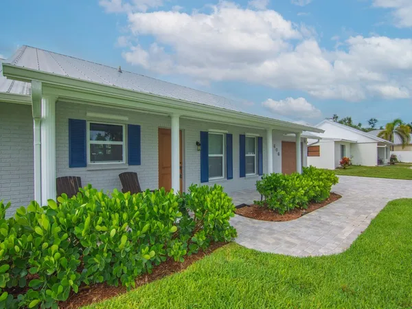 front view of a house with a yard