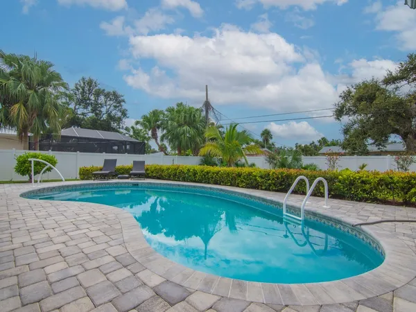 a view of a swimming pool with a garden