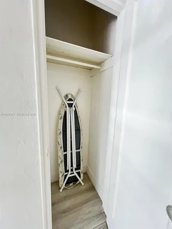 a living room with chair and a table