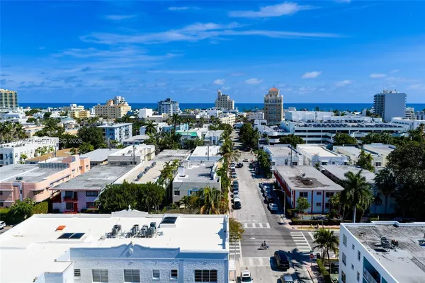 a wooden bench with trees in front of it
