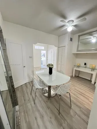 a living room with chair and a table