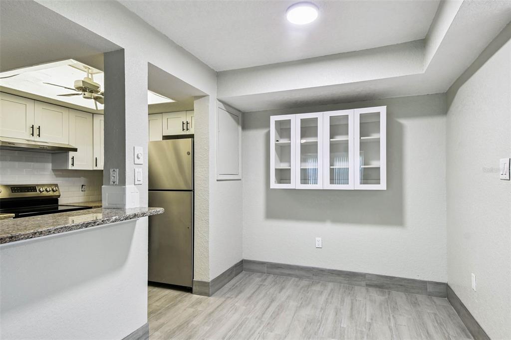 4726 Marine Parkway, Unit 103 New Port Richey, FL 34652 - Photo 11 of 81 a kitchen with a refrigerator and a stove top oven