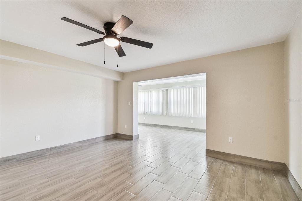 4726 Marine Parkway, Unit 103 New Port Richey, FL 34652 - Photo 16 of 81 a view of empty room with wooden floor
