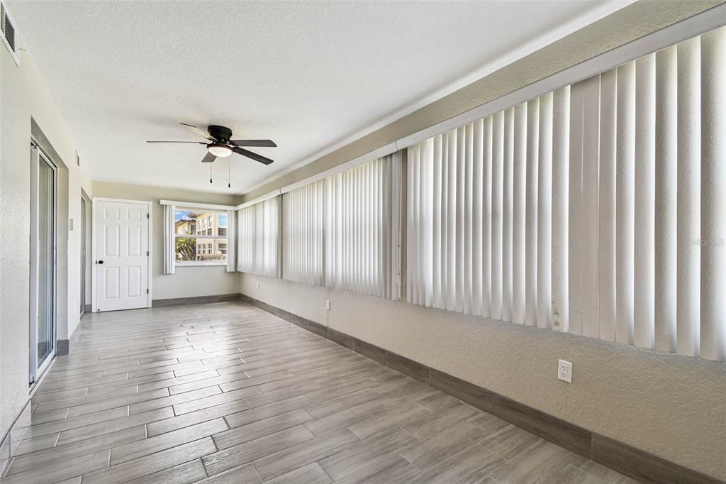 4726 Marine Parkway, Unit 103 New Port Richey, FL 34652 - Photo 17 of 81 wooden floor in an empty room with a window