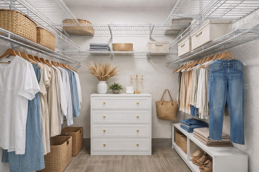 4726 Marine Parkway, Unit 103 New Port Richey, FL 34652 - Photo 24 of 81 a view of walk in closet with clothes and shoes