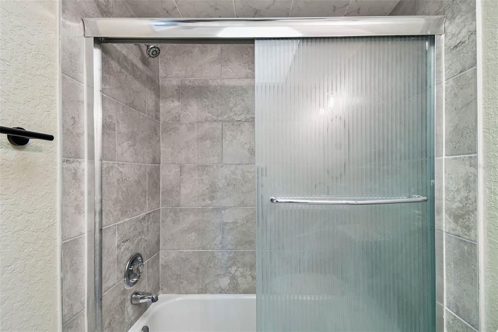 4726 Marine Parkway, Unit 103 New Port Richey, FL 34652 - Photo 40 of 81 a bathroom with a shower