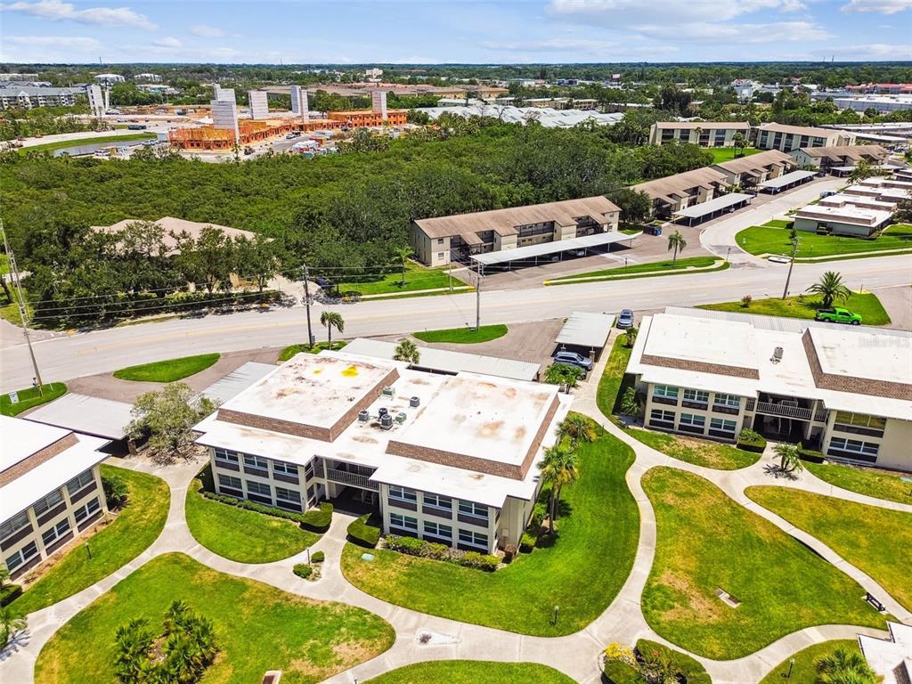 4726 Marine Parkway, Unit 103 New Port Richey, FL 34652 - Photo 47 of 81 an aerial view of a swimming pool and lake view