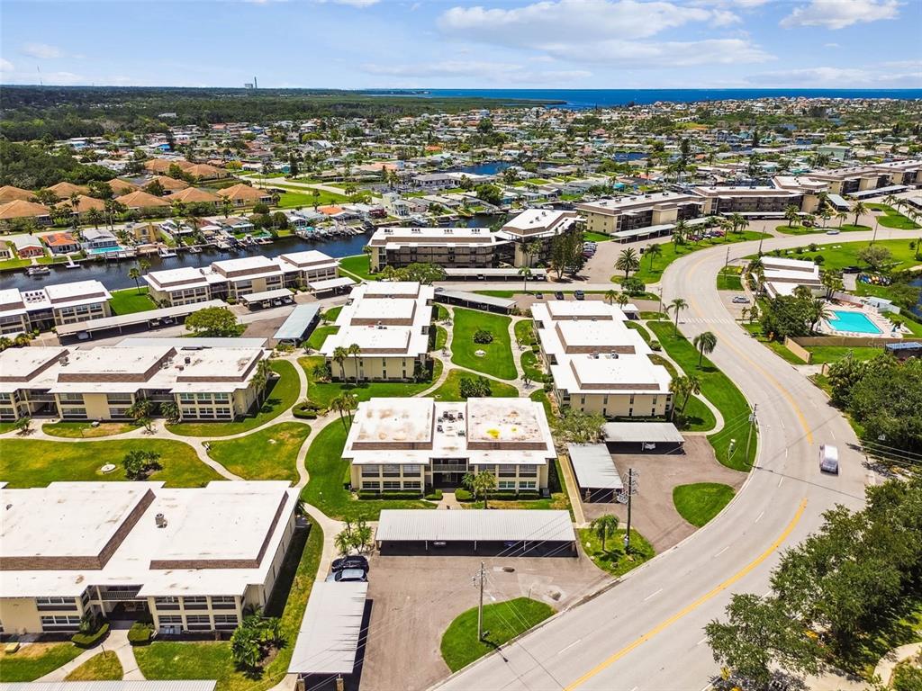 4726 Marine Parkway, Unit 103 New Port Richey, FL 34652 - Photo 51 of 81 an aerial view of residential houses with outdoor space