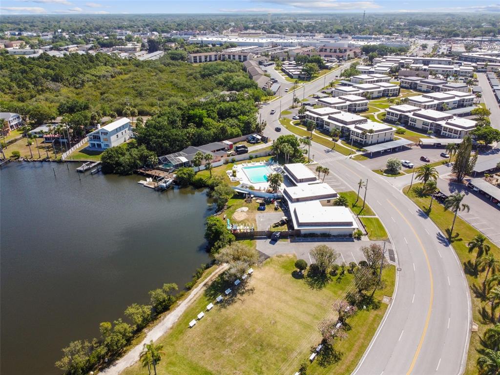 4726 Marine Parkway, Unit 103 New Port Richey, FL 34652 - Photo 65 of 81 an aerial view of a swimming pool with outdoor seating