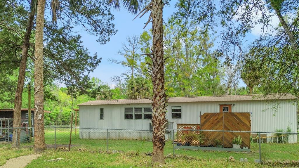 3650 176 Place Inglis, FL 34449 - Photo 35 of 49 front view of house with a yard