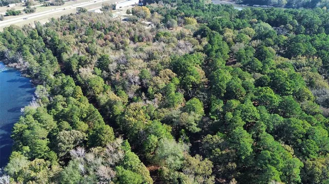 an aerial view of a houses with a yard