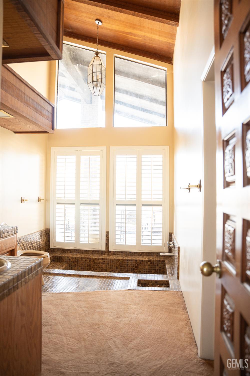 Undisclosed Address Bakersfield, CA 93308 - Photo 22 of 29 a view of a spacious bathroom with a tub a sink and a large window