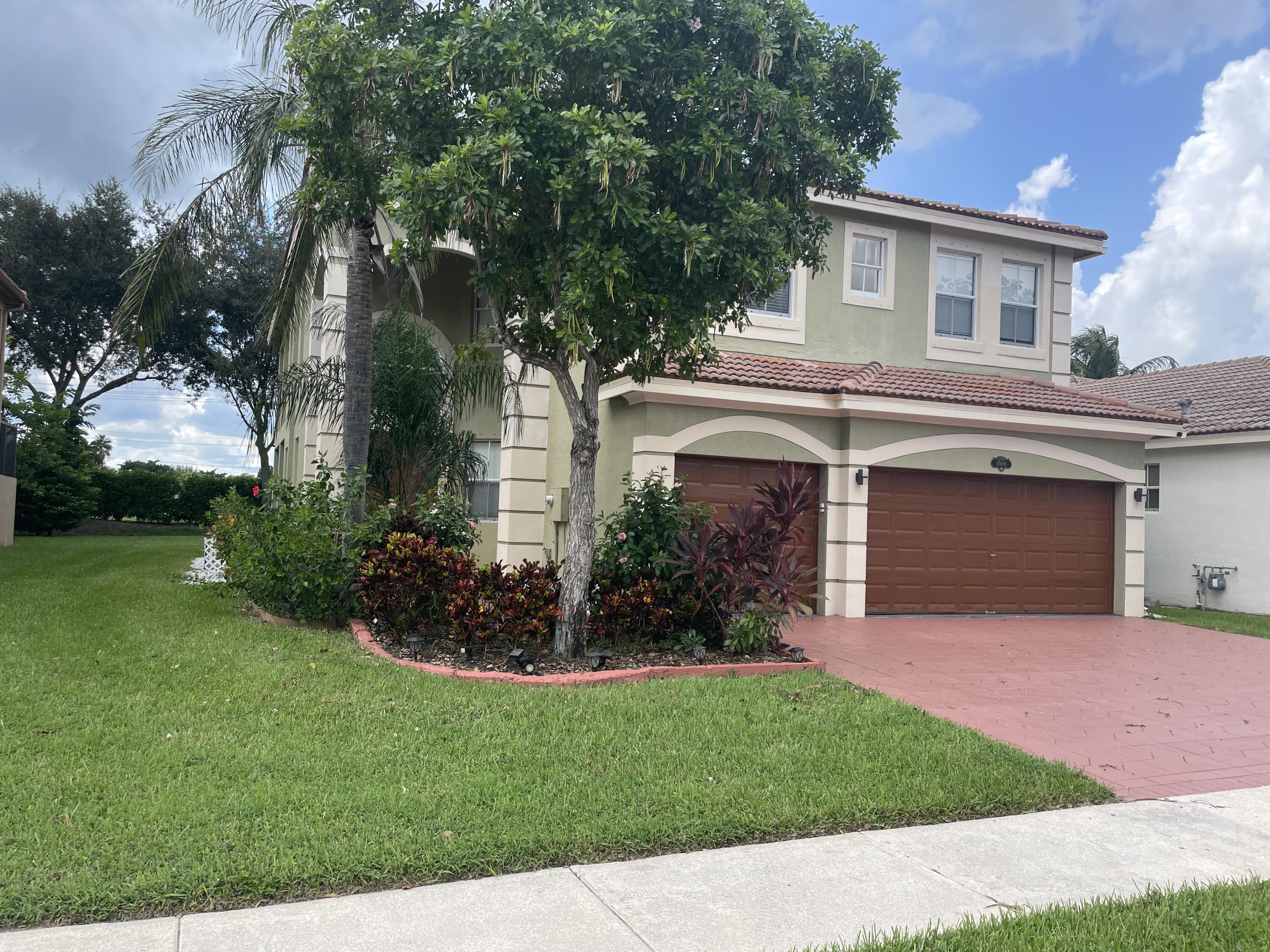 10690 OldHammock Way Wellington, FL 33414 - Photo 1 of 9 Hammock Front of House