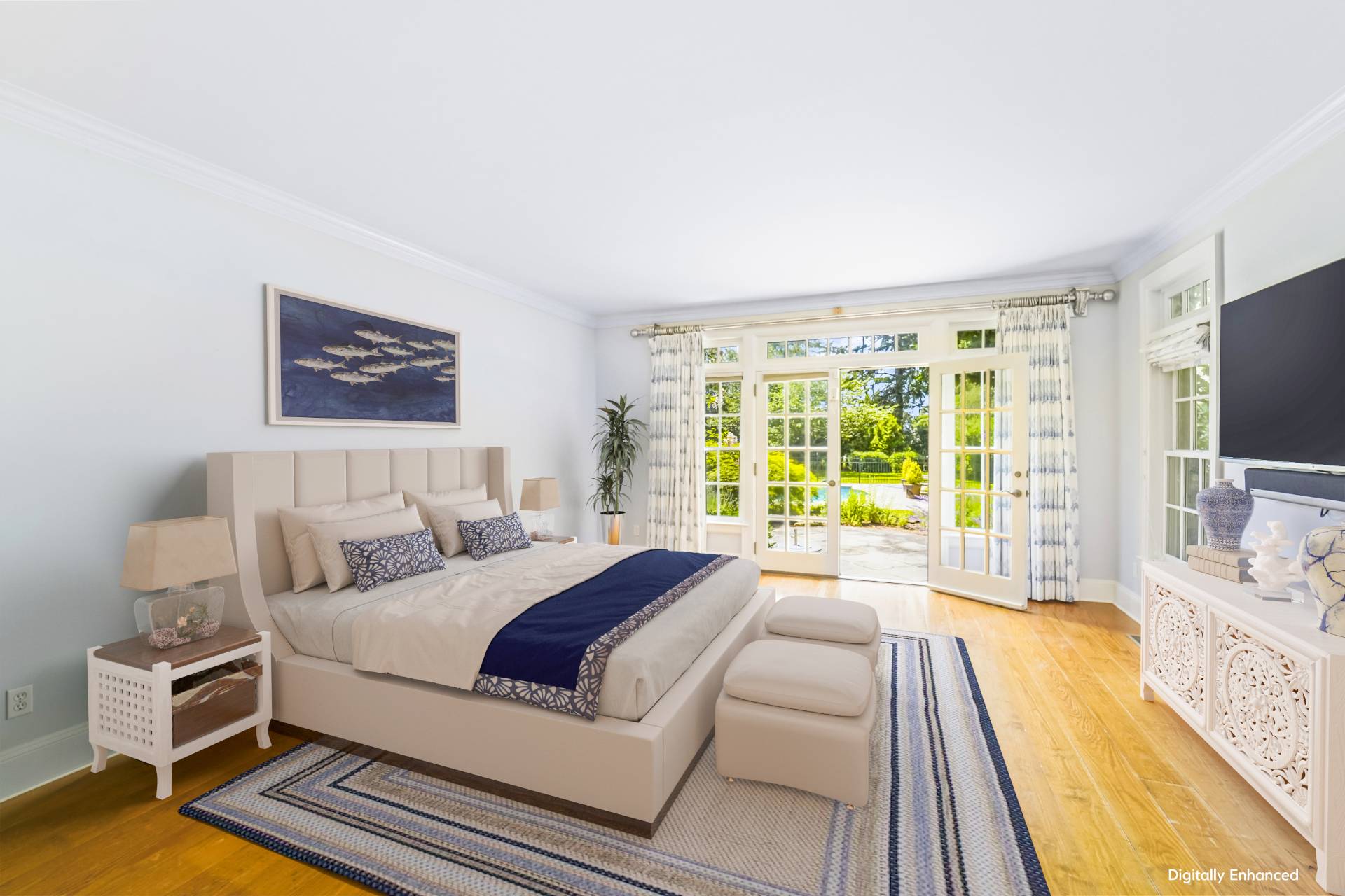 53 South Road Westhampton Beach, NY 11978 - Photo 11 of 28 a spacious bedroom with a bed and a flat tv screen on dresser