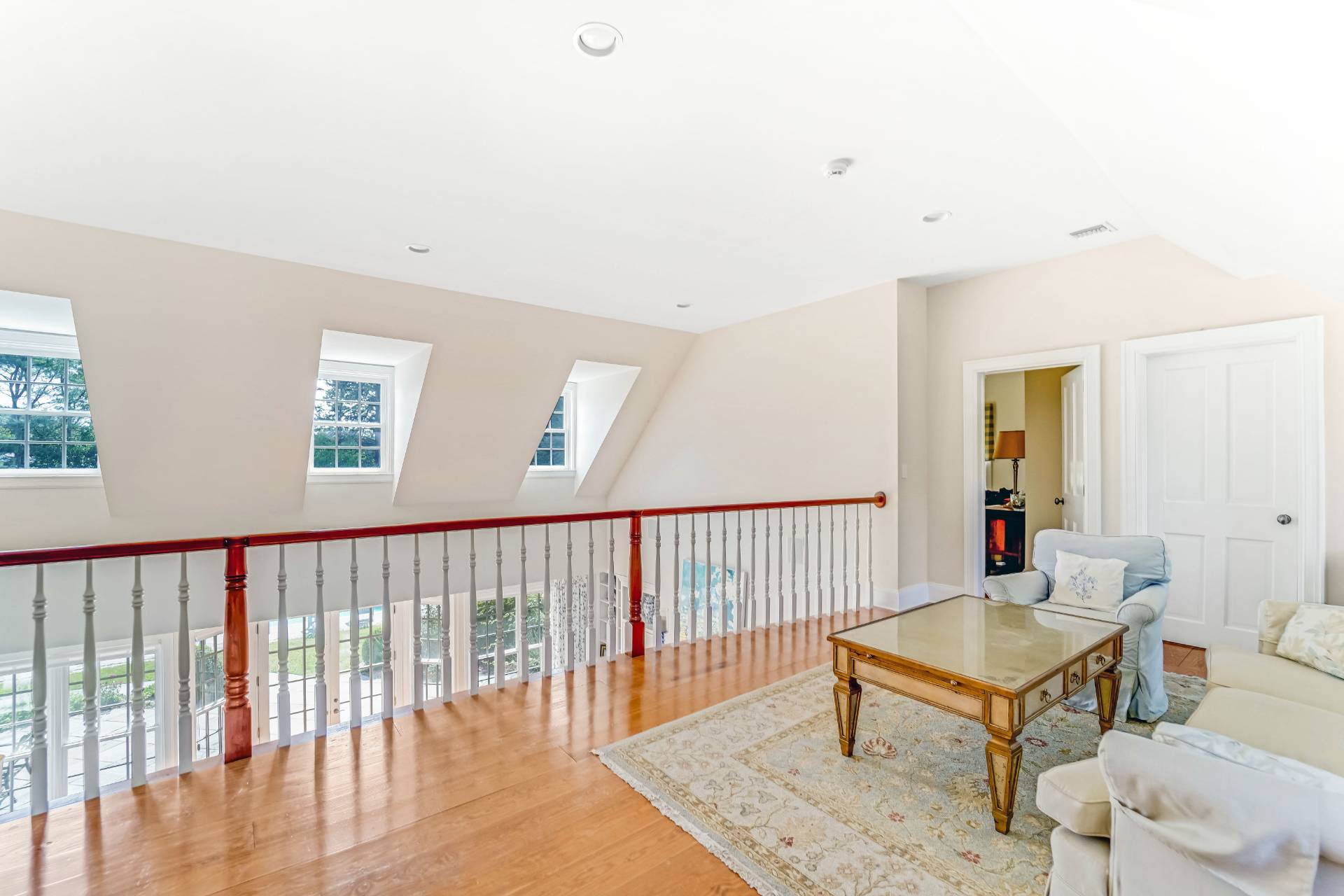 53 South Road Westhampton Beach, NY 11978 - Photo 17 of 28 a living room with furniture wooden floor and a window