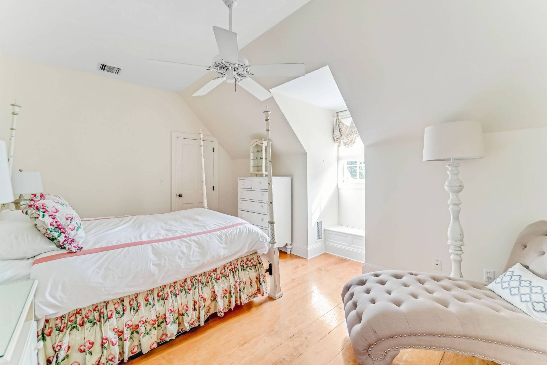 53 South Road Westhampton Beach, NY 11978 - Photo 18 of 28 a bedroom with a bed and a chandelier