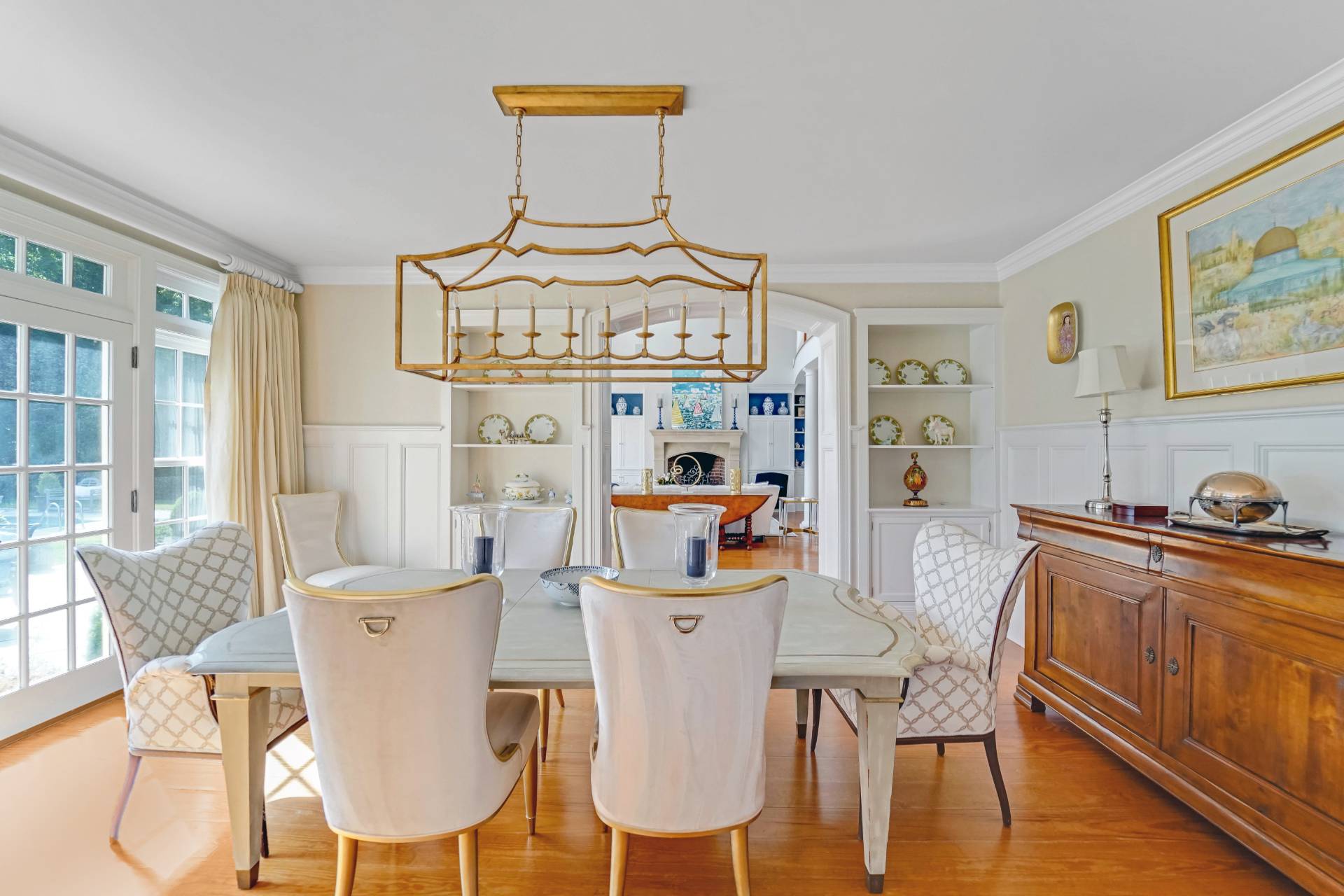 53 South Road Westhampton Beach, NY 11978 - Photo 8 of 28 a dining room with furniture a window and wooden floor
