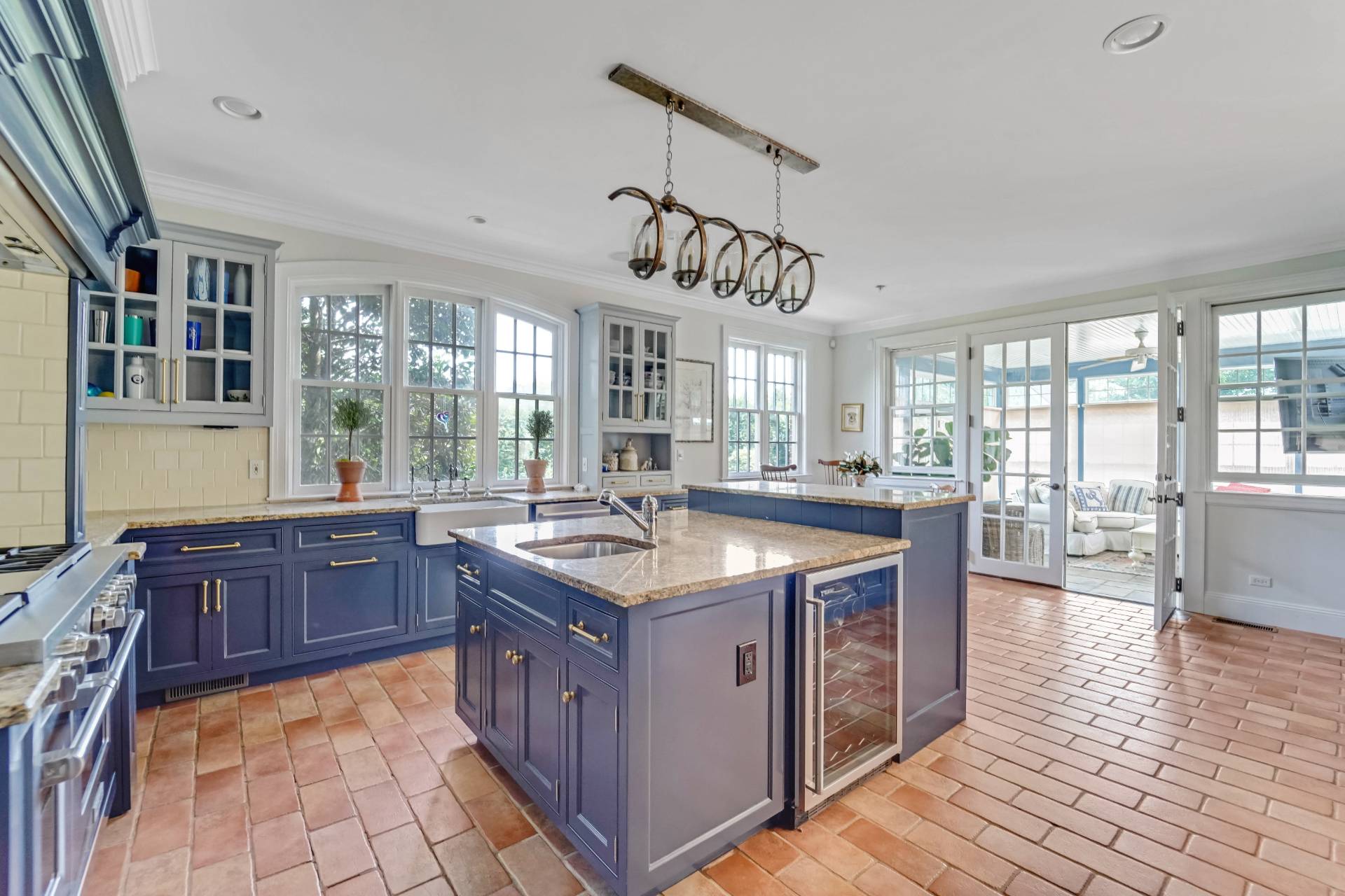 53 South Road Westhampton Beach, NY 11978 - Photo 10 of 28 a kitchen with stainless steel appliances granite countertop a sink and wooden cabinets