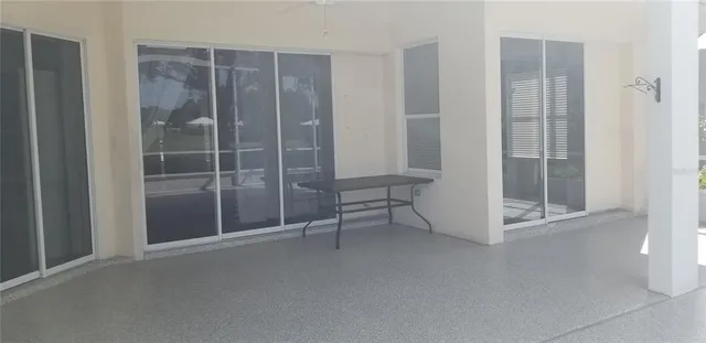 a view of an empty room with glass door