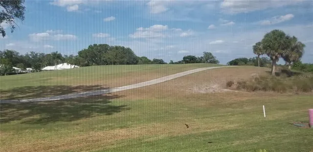 a bathroom with a granite countertop sink and a window