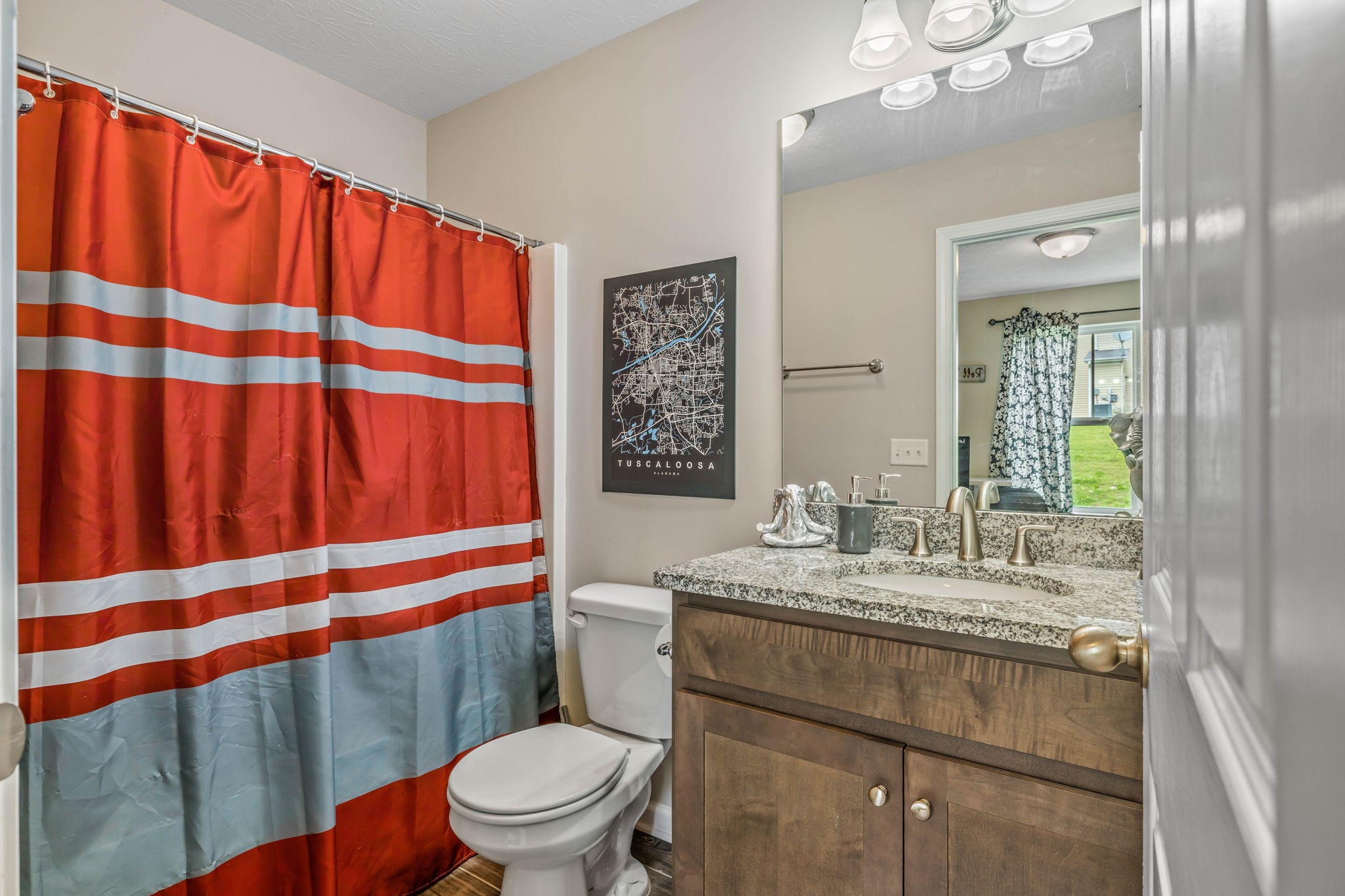 1382 Rural Hill Road, Unit 359 Antioch, TN 37013 - Photo 23 of 33 a bathroom with a sink a toilet and shower curtain
