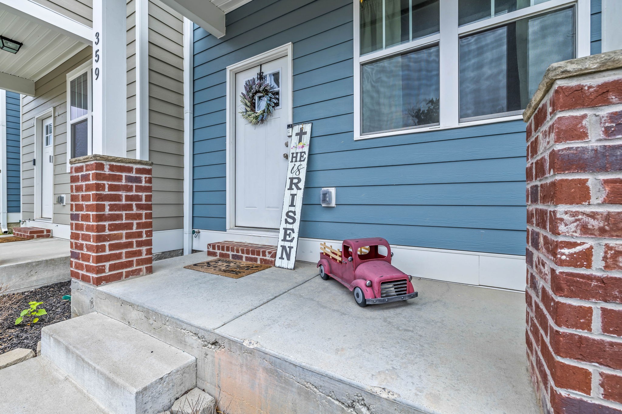 1382 Rural Hill Road, Unit 359 Antioch, TN 37013 - Photo 3 of 33 a front view of a house with outdoor seating