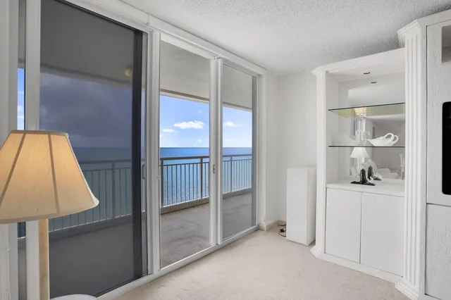 a living room with furniture white walls and white walls
