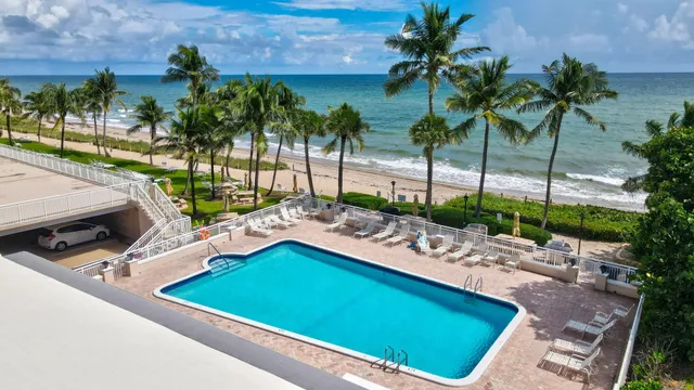 a view of a swimming pool with a patio