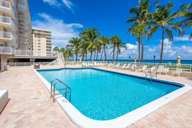 a view of a patio with couches and a fire pit