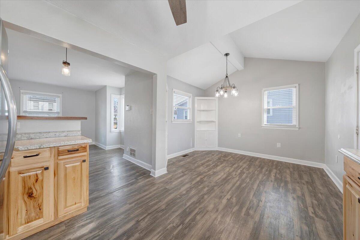 1902 Springfield Avenue Salem, VA 24153 - Photo 12 of 43 an empty room with wooden floor and windows