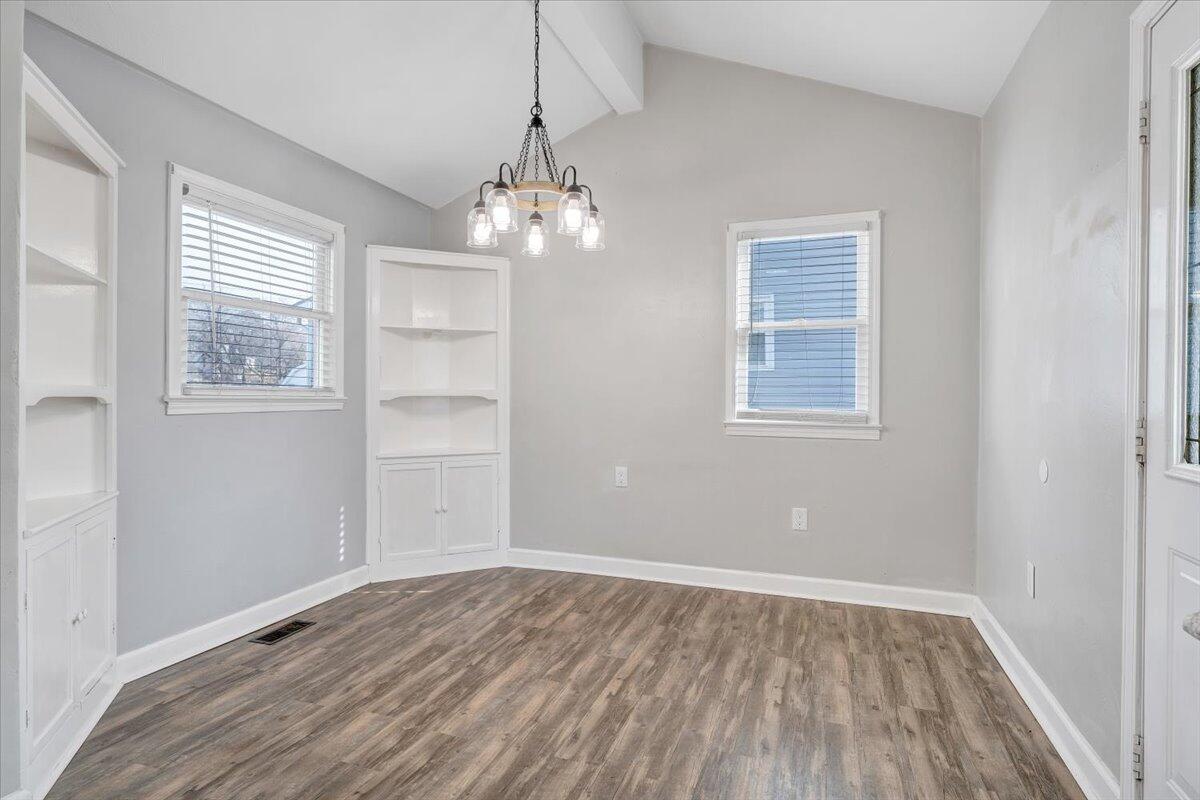 1902 Springfield Avenue Salem, VA 24153 - Photo 13 of 43 wooden floor in an empty room with a window