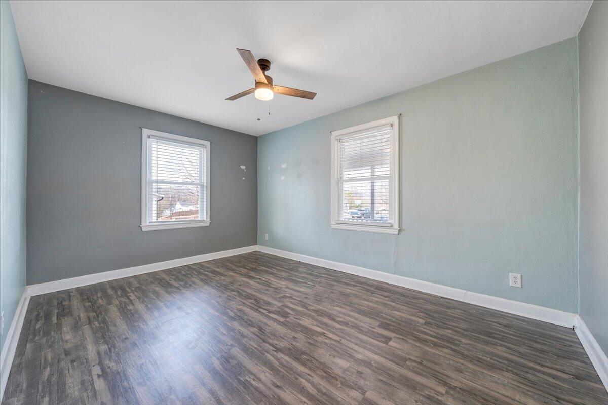 1902 Springfield Avenue Salem, VA 24153 - Photo 17 of 43 a view of empty room with wooden floor and fan
