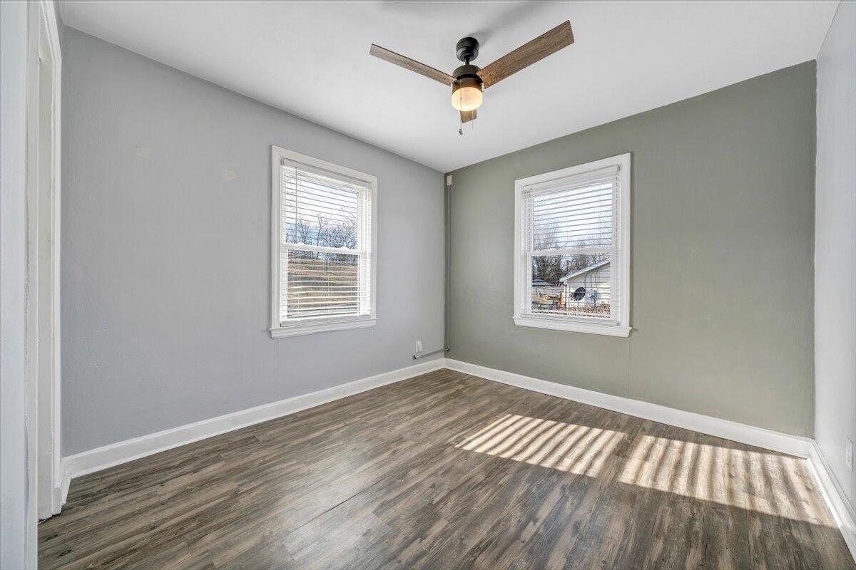1902 Springfield Avenue Salem, VA 24153 - Photo 18 of 43 a view of empty room with wooden floor and fan