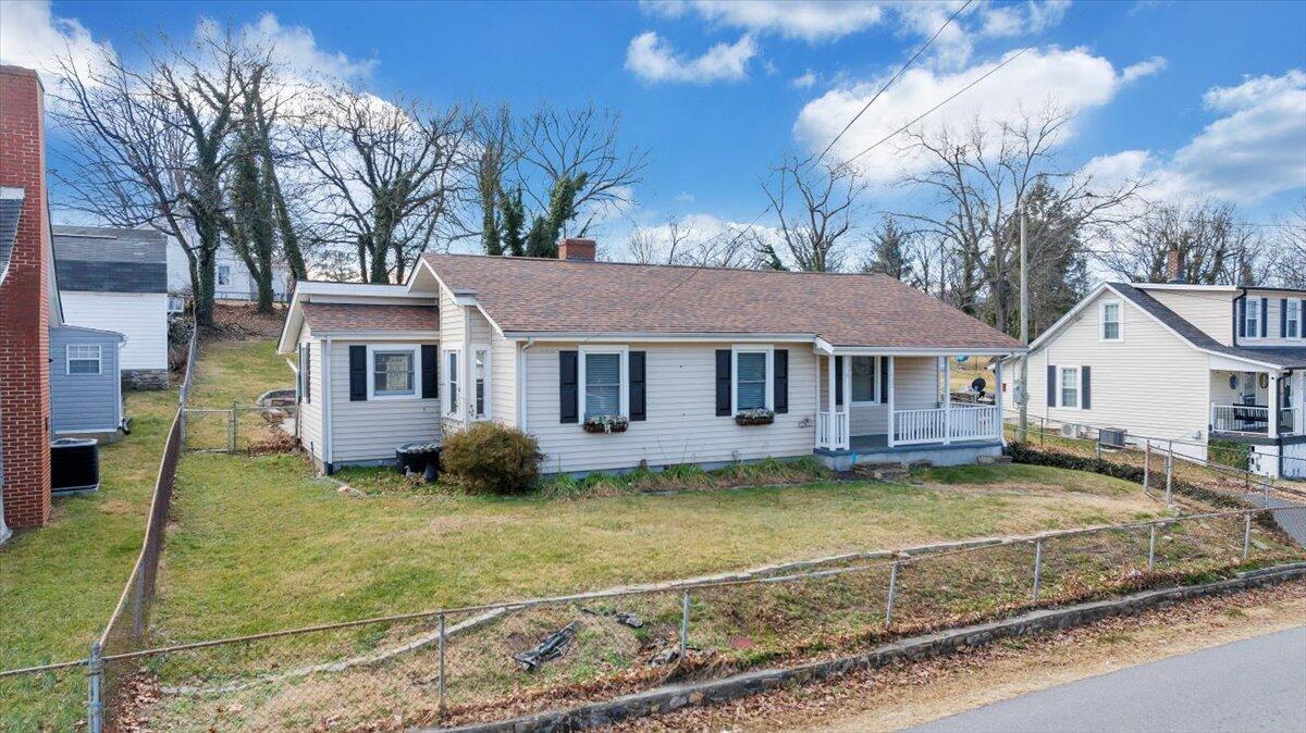 1902 Springfield Avenue Salem, VA 24153 - Photo 38 of 43 a view of a white house with a big yard and large tree