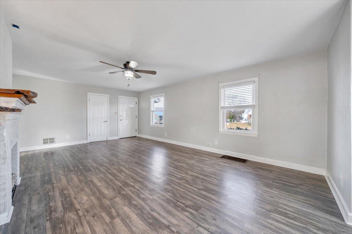 1902 Springfield Avenue Salem, VA 24153 - Photo 5 of 43 an empty room with wooden floor and windows