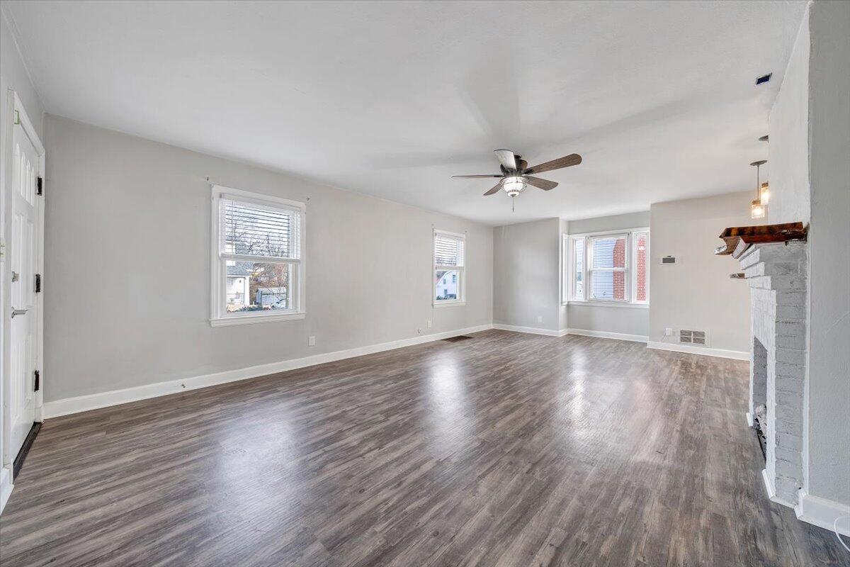 1902 Springfield Avenue Salem, VA 24153 - Photo 8 of 43 wooden floor in an empty room with a window