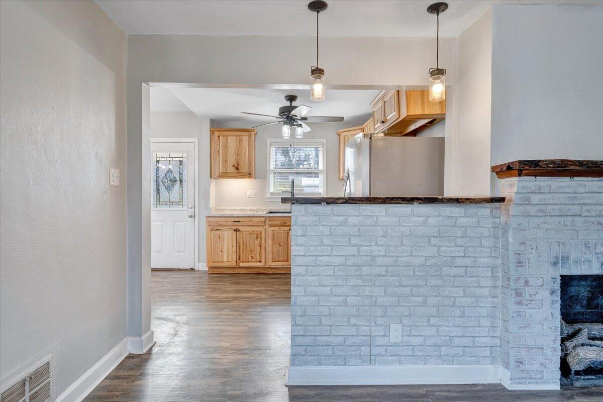 1902 Springfield Avenue Salem, VA 24153 - Photo 9 of 43 a view of a kitchen with a sink dishwasher a refrigerator and wooden floor